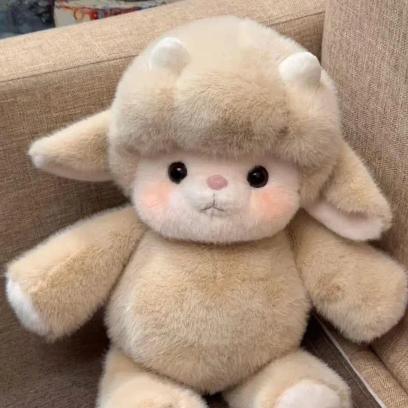 Cute plush toy sheep sitting on a beige couch