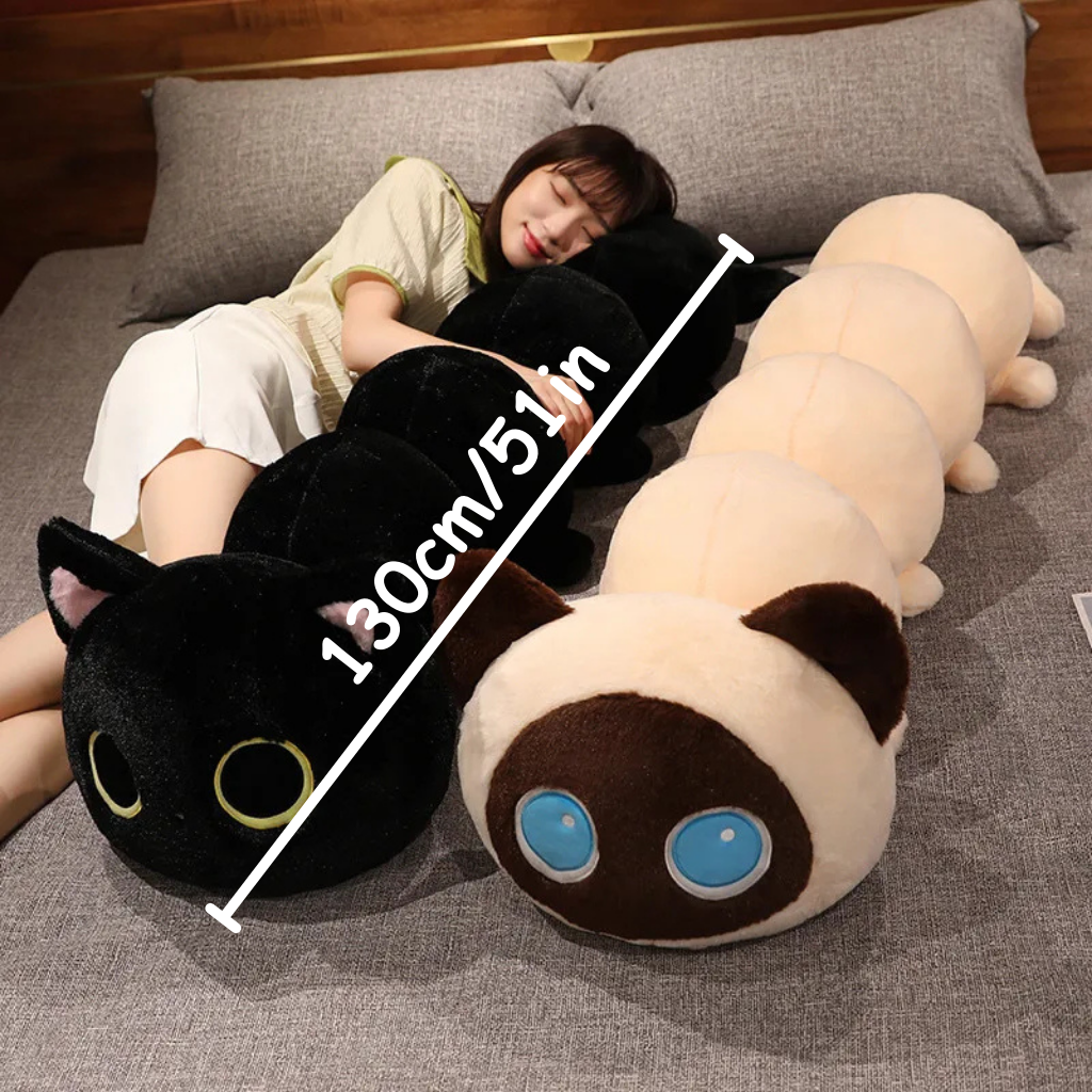 Two large caterpillar-shaped plush toys in black and brown on a bed, size indicated as 130cm/51in