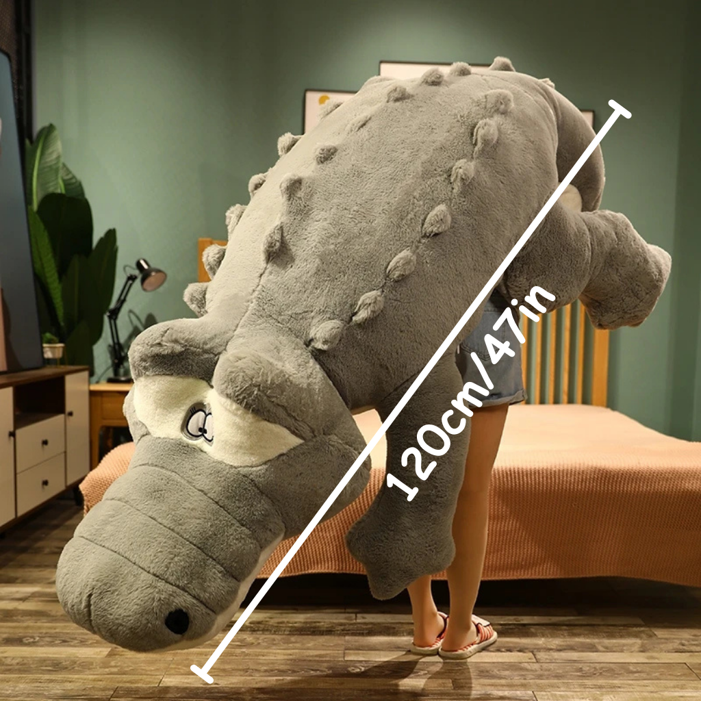 Large gray crocodile plush toy with a person for scale stating 120cm/47in